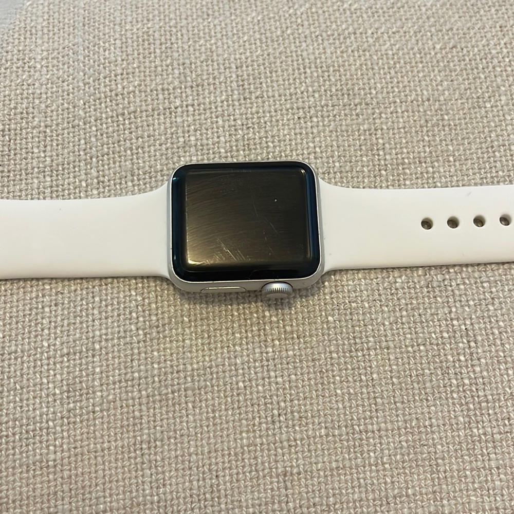 Series 2 38 MM Apple Watch with charger and white band